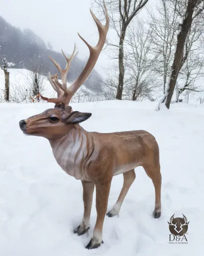 Resin statue of a life-size standing deer