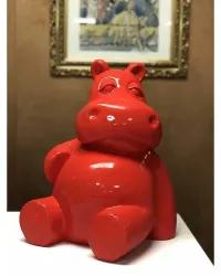 Hippopotame assis L